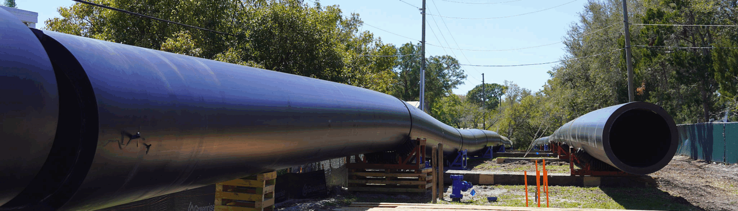 Rows of 54-inch HDPE pipe are strung out prior to being fused together.